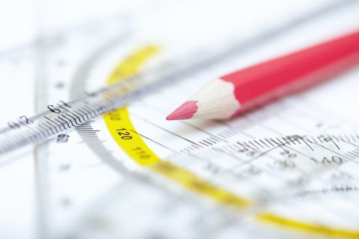 Drawing tools on a paper. Extremely close-up photo with shallow depth of field