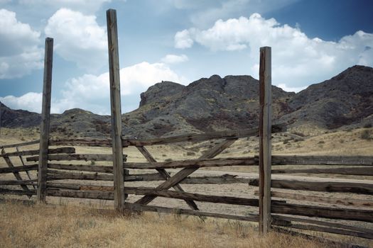 Lonely wooden fence outdoors near the rocks
