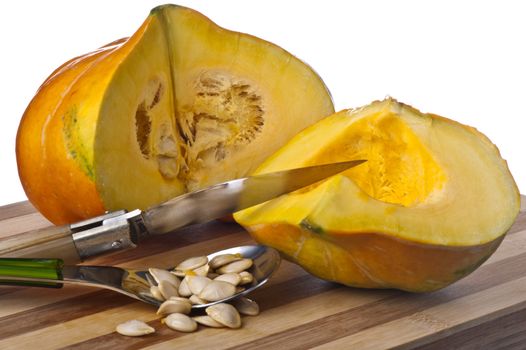 a small yellow squash on a bamboo cutting board 