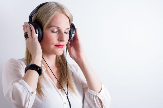 Image of Woman Listening To Music With Headphones