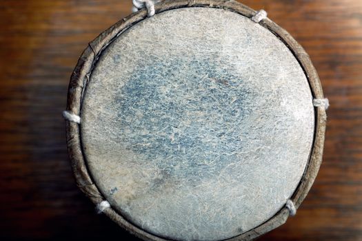 Old leather drum. Top view on the surface. Horizontal photo with shallow depth of field 