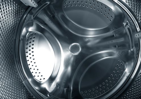 Close-up photo of the metal circular element of washing machine