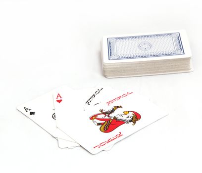 Playing cards. ace and a joker on a green background