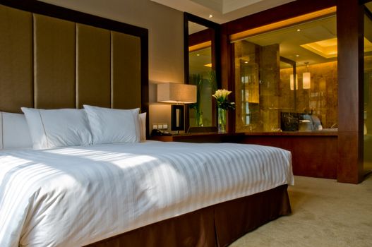 Bedroom of a elegant 5 star hotel suite room and attached marbel bathroom