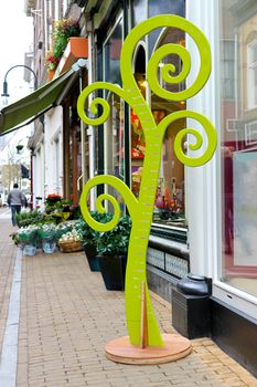 Stadiometer - tree near  store colors in Gorinchem. Netherlands