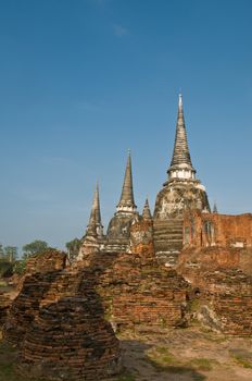 Stupas (chedis) of a Wat in Ayutthaya, Thailand. Ayutthaya city is the capital of Ayutthaya province in Thailand. Its historical park is a UNESCO world heritage.