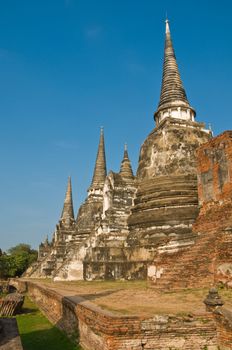 Stupas (chedis) of a Wat in Ayutthaya, Thailand. Ayutthaya city is the capital of Ayutthaya province in Thailand. Its historical park is a UNESCO world heritage.