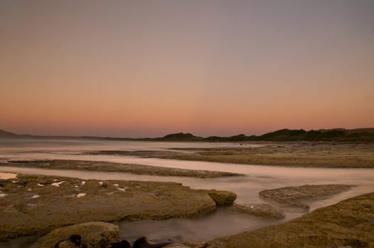 Twilight after a sunset at a beach, with long exposure