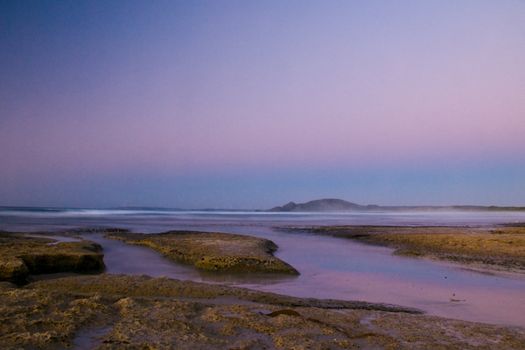 Twilight after a sunset at a beach, with long exposure