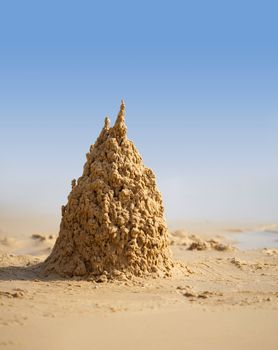 Surreal sand castle on a sunny tropical beach