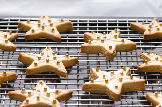 Decorated star shape christmas cookies on the backing tray
