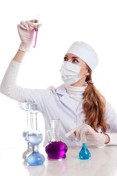 Scientist woman in lab coat with chemical glassware isolated on white