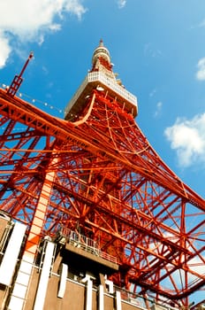 Tokyo tower face cloudy sky on a bright day