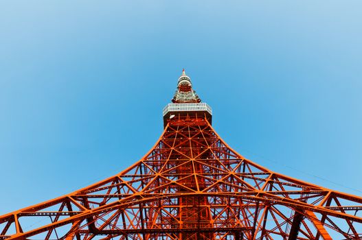 Tokyo tower faces blue sky with no clouds