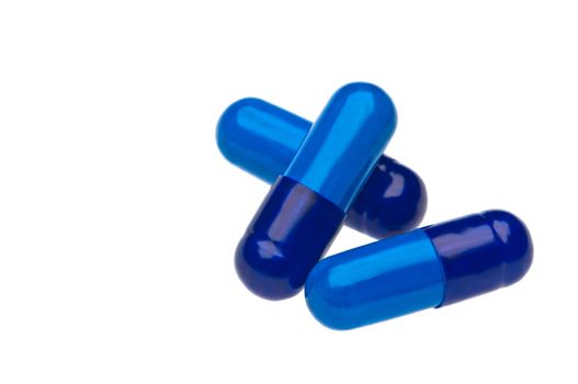 Three blue capsules over white two as a stack