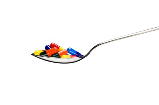 One spoon of medication in front of a White background