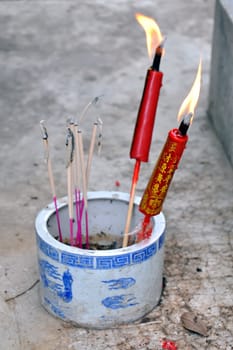 Lighting candles for the temple