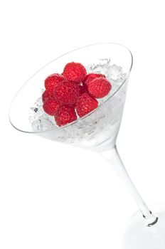 Raspberry cocktail in a martini glass over white