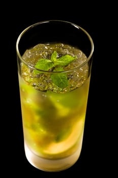 Mojito cocktail in front of a black background