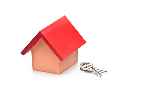 red roofed house over white with house keys