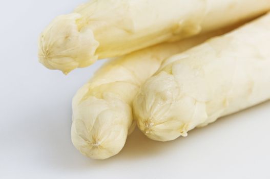 Beautiful white jumbo asparagus close up shoot over white