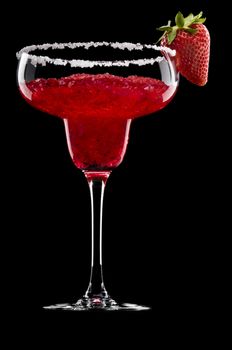 Strawberry Margarita in front of a black background with fresh garnish