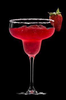 Strawberry Margarita in front of a black background with fresh garnish