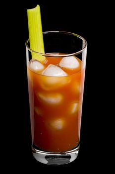 Bloody mary cocktail over a black background