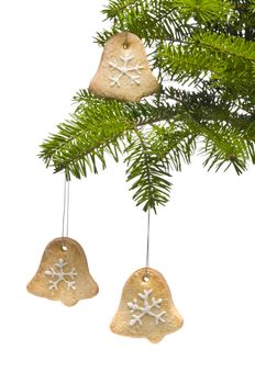 Tree bell shape cookies as Christmas tree decoration, over white