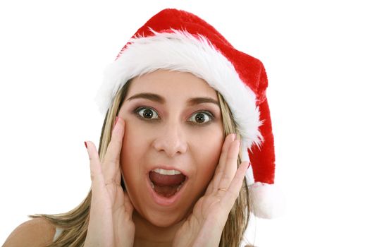 woman in santa hat surprised for Christmas.