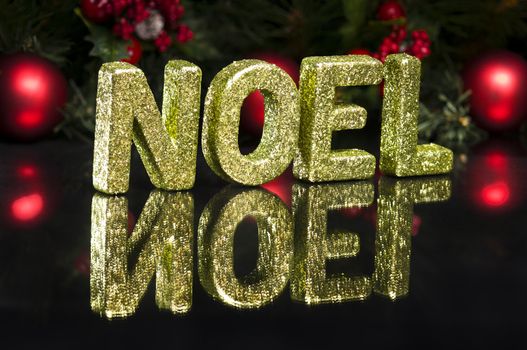 In capital letter written noel, glitter effect over black