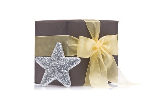 Present decorated with a glitter star, over white