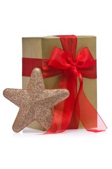 Present decorated with a glitter star, over white