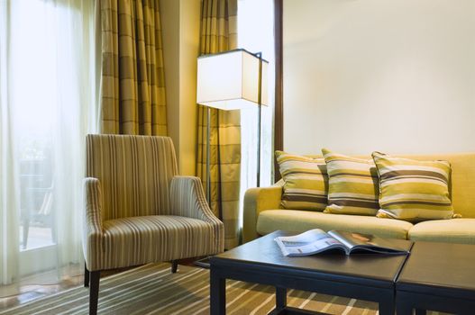 Seating area of a luxury living room in brown beige color