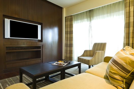 Seating area of a luxury living room in brown beige color