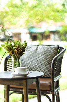 Chair and coffee table in a decorative outdoor setting