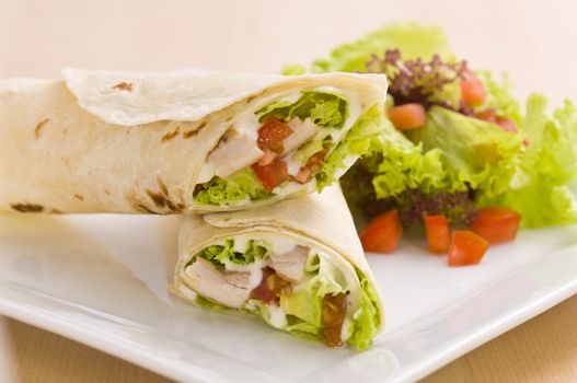 Two avocado wrap with a healthy side salad decorated