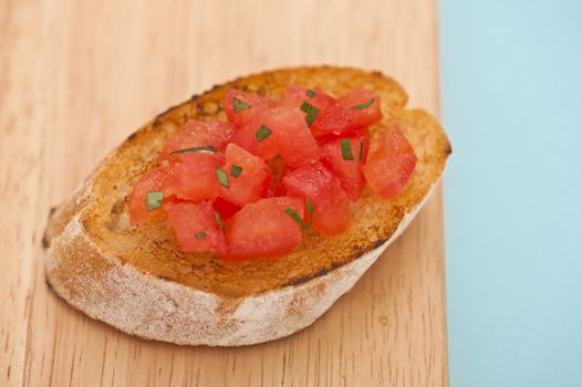 Prepared Bruschetta on a wooden board, close-up shoot