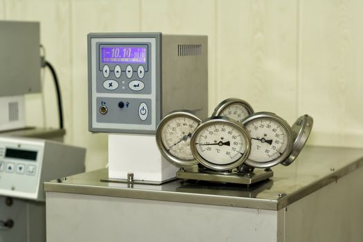 Testing of industrial thermometers in a laboratory thermostat.