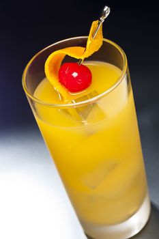 Harvey Wallbanger Cocktail in front of different colored backgrounds