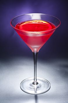Negroni cocktail in front of different colored backgrounds