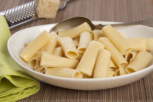 Italian Pasta - Big Penne rigate with Butter on a white plate