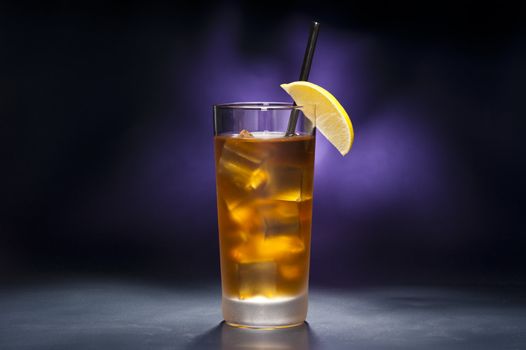 Long Island Iced tea in front of purple background