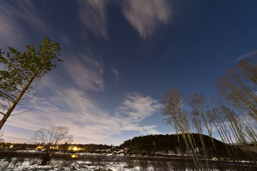 Winter scene in Norway, above the Arctic Circle with a glimpse of the northern lightsb