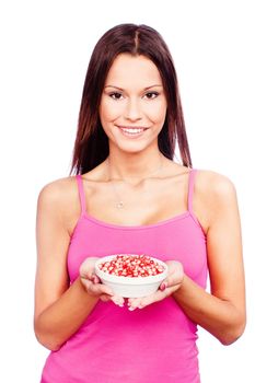 Young woman holding pomegranate on plate, isolated on white