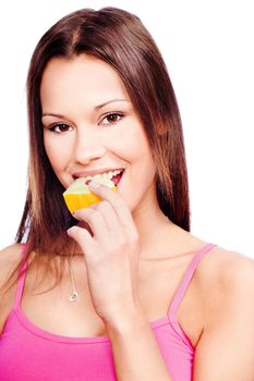 Young woman eating slice of yellow melon, isolated on white