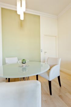 Contemporary table and seating area with a closed door in the background