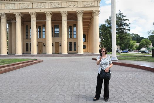 A woman takes off on mobile phone camera