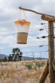 Fly Trap hanging on a electrical fence