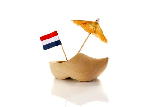dutch wooden shoe with netherland flag in orange red white and blue